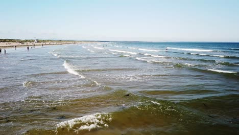 West-sands-St-Andrews,Fife,Scotland-with-gentle-waves,sand-and-sun