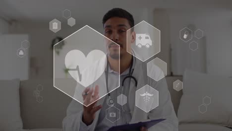 Animation-of-computer-icon-in-hexagons-over-biracial-doctor-talking-while-looking-at-camera