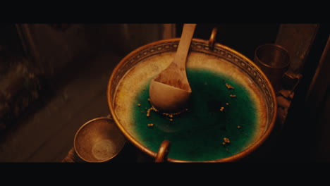 a wase with a potion inside the circus cart