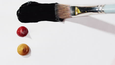 paint brush and colorful paints