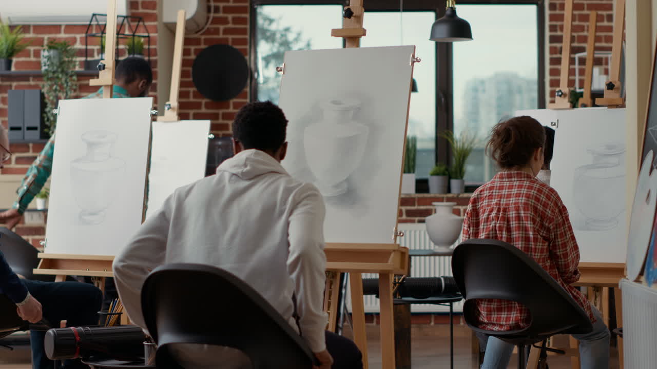 Senior artist greeting students attending art class lesson