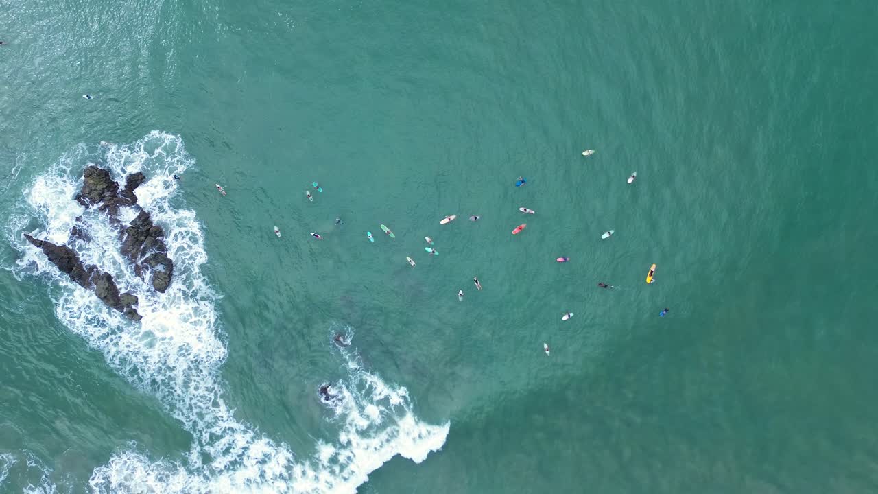 Aerial View of Surfers in the Ocean