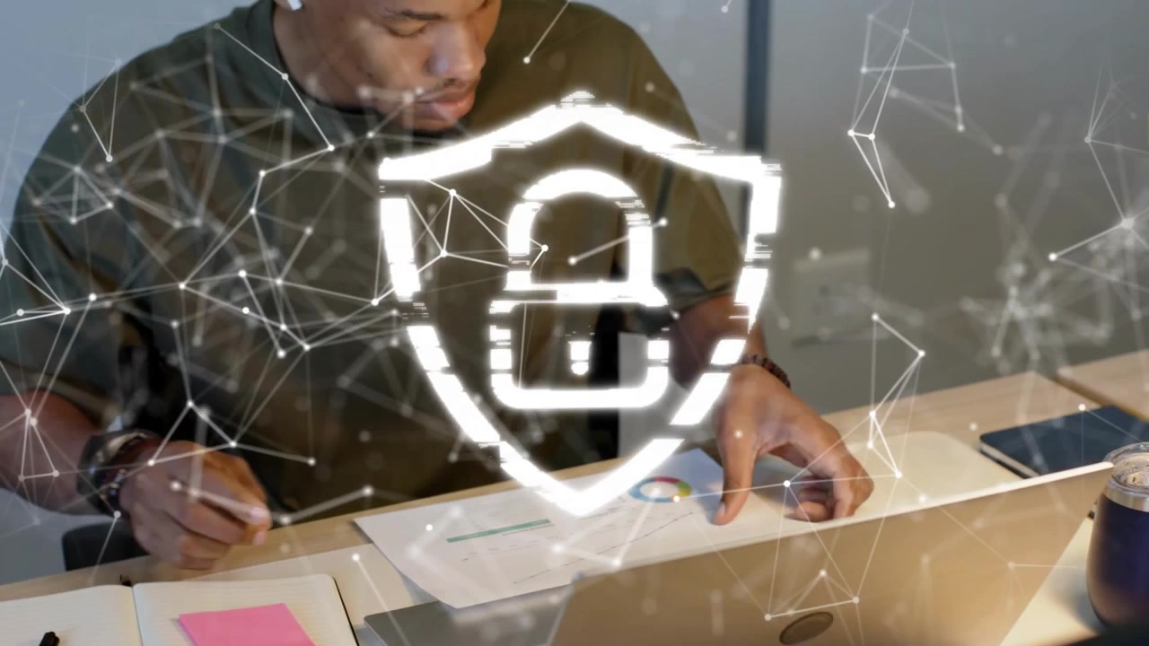 Man writing then reacting to overlay padlock touching laptop and flipping pie chart for security