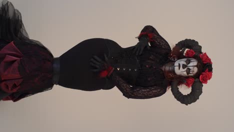 woman in a dark fantasy costume with horns and roses