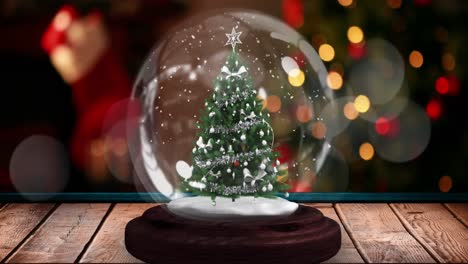 animaciones de la bola de nieve de navidad sobre las luces de navidad