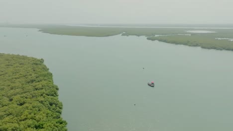 The Indus River Delta mangrove near Karachi drone shot with Boat in the center
