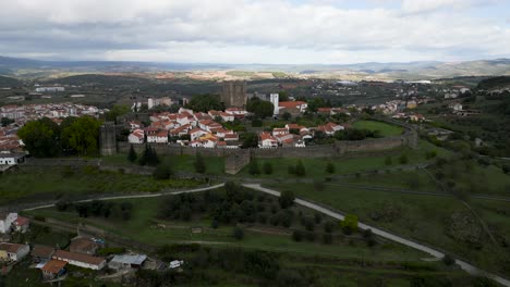 Drone-descend-tilt-up-jib-of-medieval-castle-in-historic-center-of-Braganza-Portugal