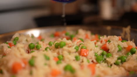 Adding-fresh-lemon-juice-to-a-savory-dish---slow-motion,-close-up,-isolated