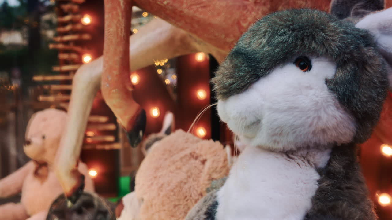 A closer view of a plush rabbit toy in shop window display