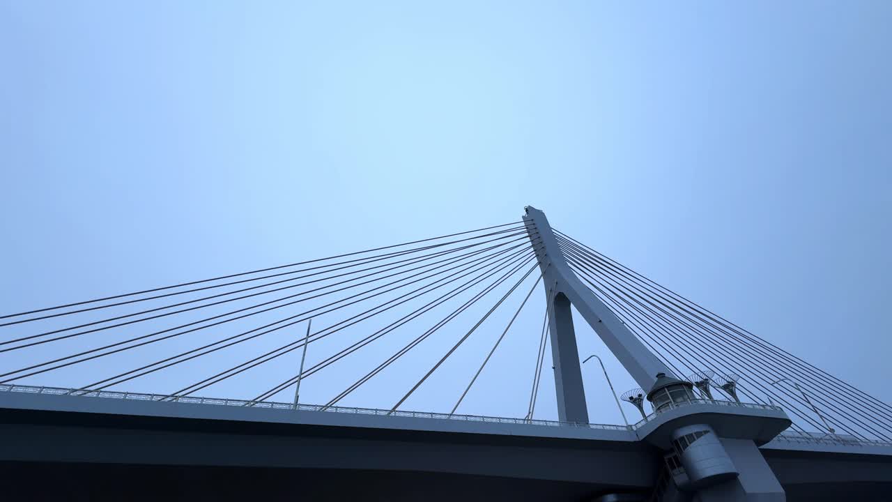 Cable-stayed bridge at Aomori Bay, Japan, viewed from below on a cloudy day