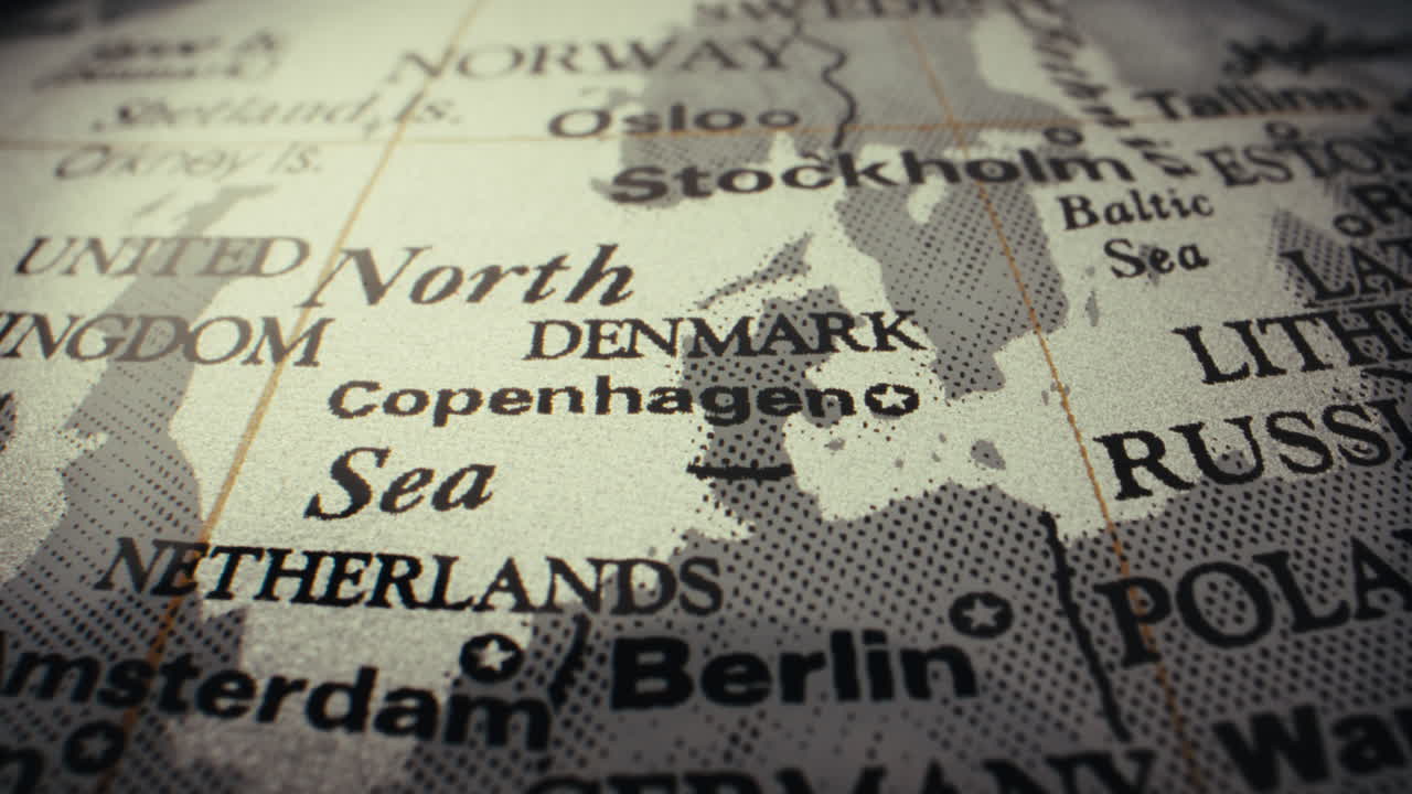 Close-up of a vintage world map, focused on Denmark and Copenhagen.