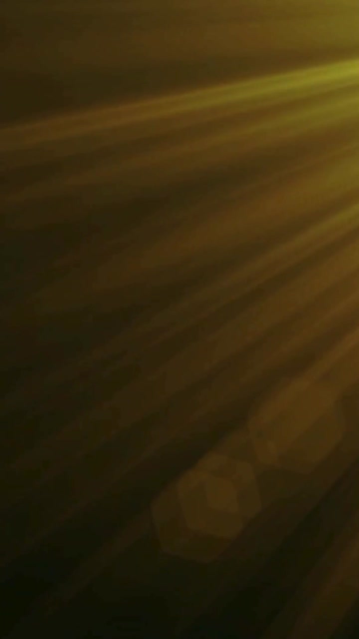 Abstract Golden Light Rays Moving on Dark Background