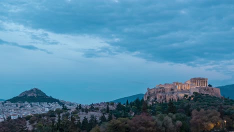 dusk to night time lapse at acropolis in athens with light up