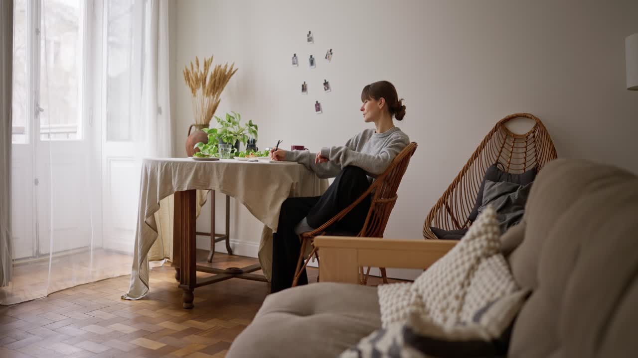 Woman relaxing at home during a meal