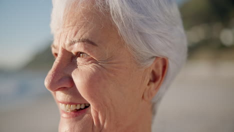 Senior-woman,-smile-and-sunset-at-a-beach