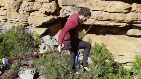 Highline-athlete-balancing-on-slackline-rope-4k