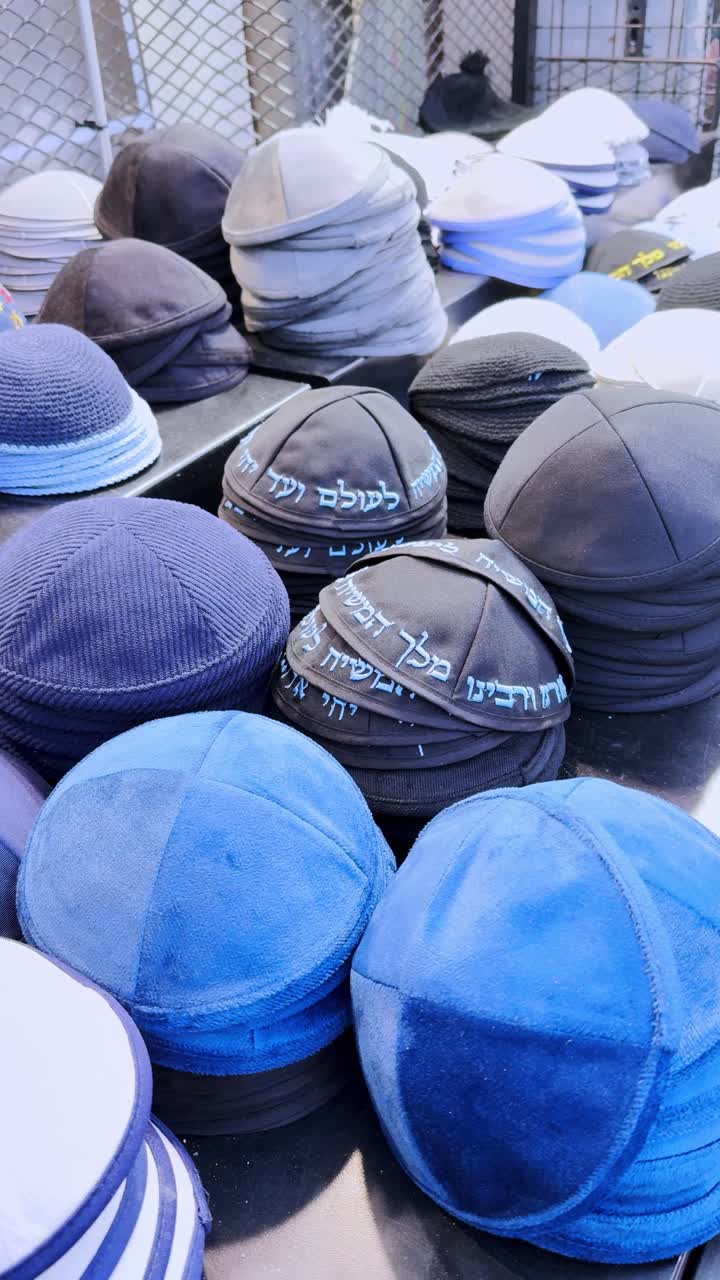 Jewish yarmulke kippah hats on display in a jerusalem market