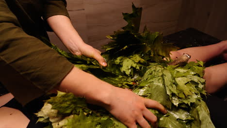 banya or russian bath treatment with herbal leaves