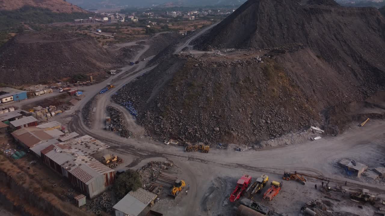 The Mumbai Pune Expressway missing link project construction site, excavated soil, sand and rock heap,Lonavala, Maharashtra, Drone shot