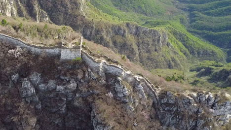 aerial rises above watch tower ruin on remote great wall of china