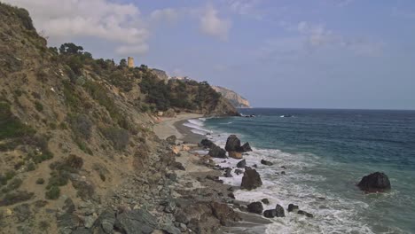 Drone-flying-forward-at-rocky-beaches