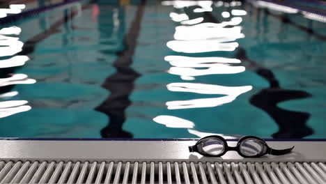 swimming goggles by the pool