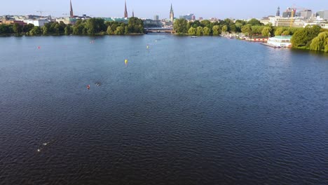 Aerial-view-of-the-outer-alster-lake-with-swimmmers-during-Ironman-in-Hamburg