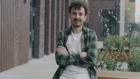 man sitting on bench in urban setting