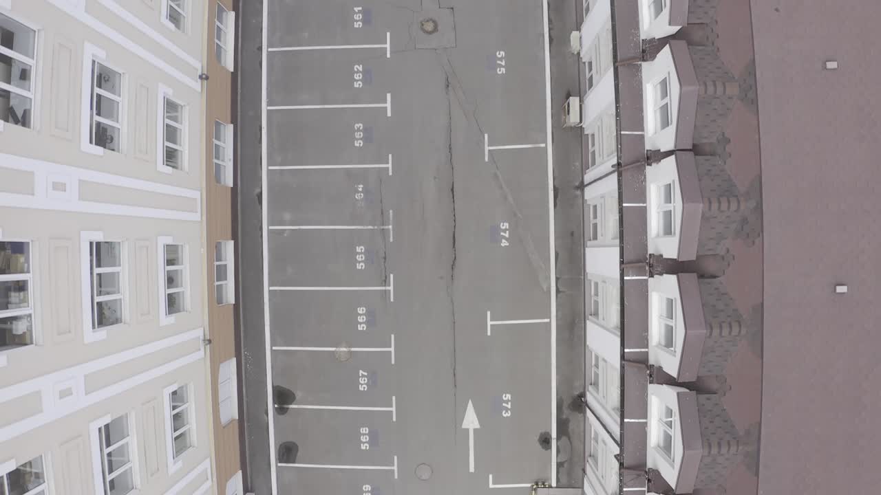 Overhead View of Parking Lot Between Buildings