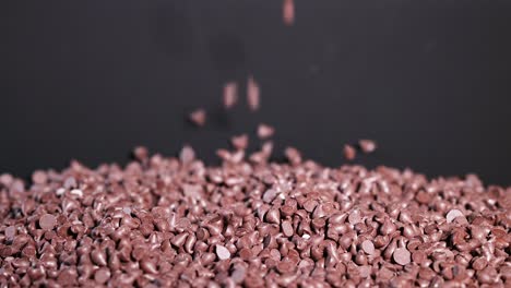 chocolate chips cascading onto a pile