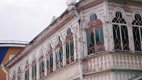 ornate wooden house with stained glass windows