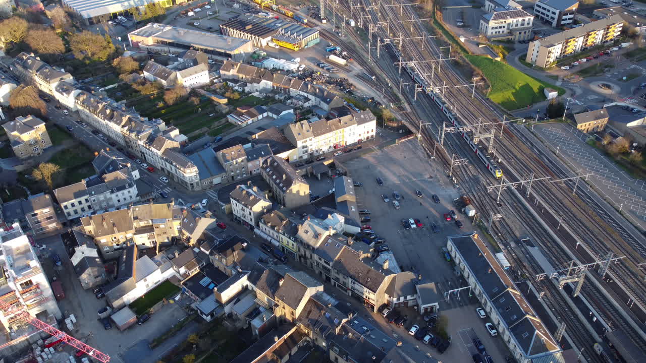 Aerial View of a European City with Train Tracks