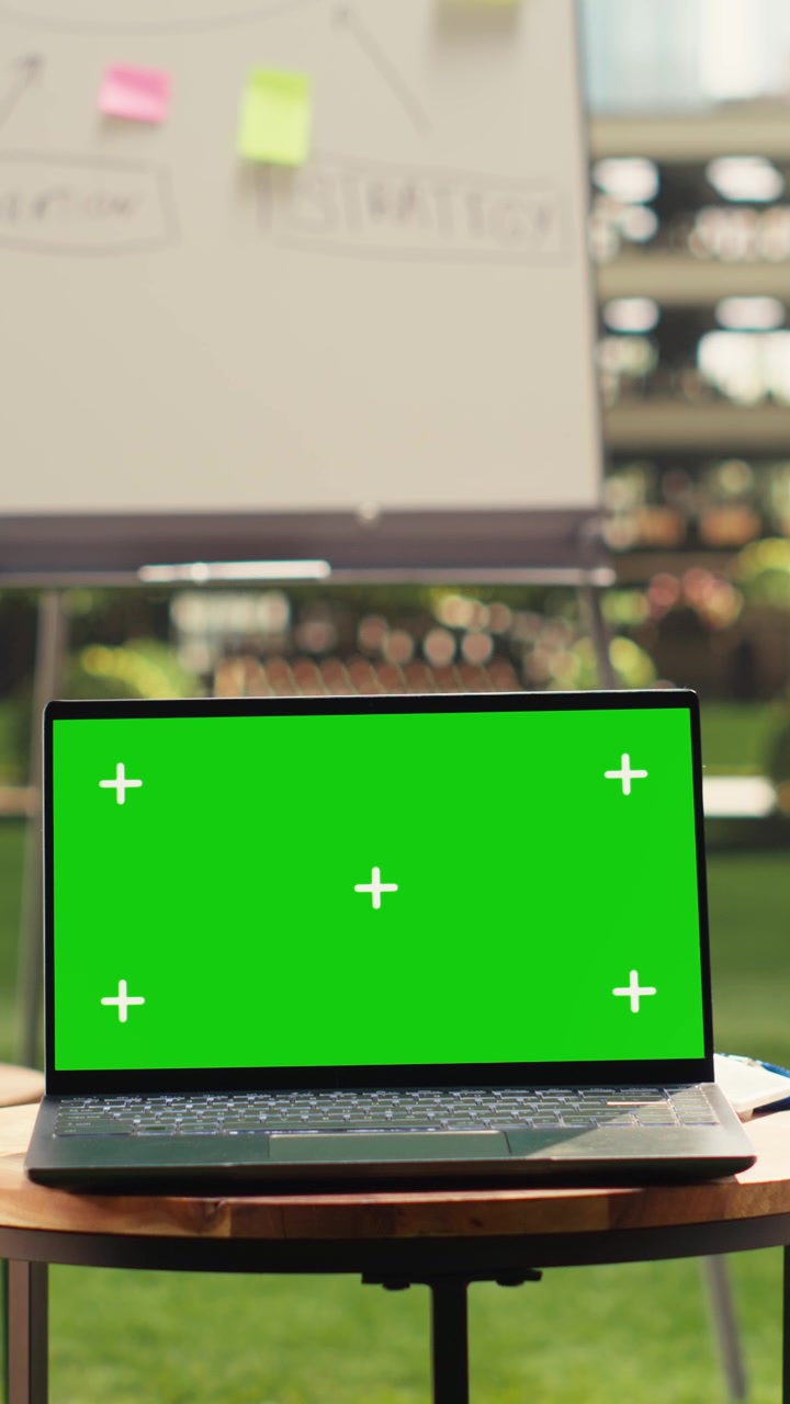 Vertical Video Chroma key screen replacement on laptop in empty modern office terrace