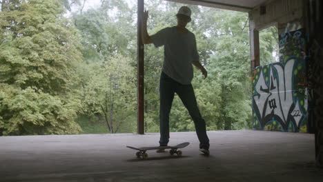 caucasian boys skateboarding in a ruined building.