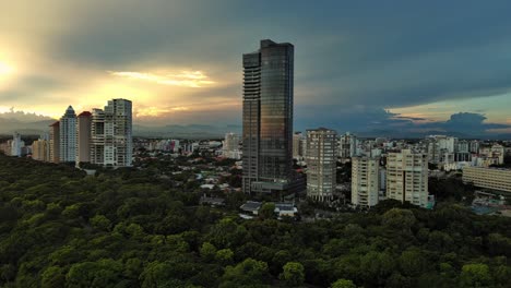 anacaona 27 tower skyscraper and mirador sur park. santo domingo in dominican republic. aerial forward