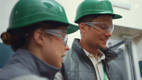 facility supervisors inspecting manufacture closeup. managers working together.