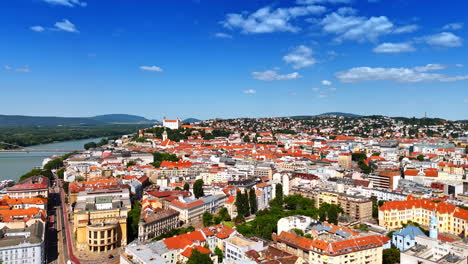old town of bratislava, slovakia with orange roofs. drone flight above the historical part of the city at day