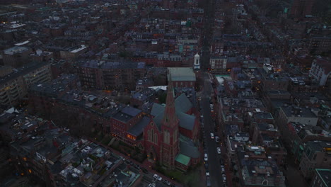 Aerial-slide-and-pan-shot-of-Church-of-the-Advent-in-residential-urban-development.-High-angle-view-of-apartment-houses-around.-Boston,-USA