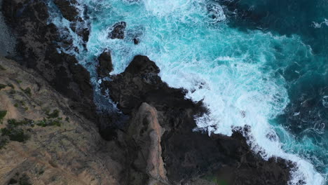 aerial view of ocean waves crashing against rocky shore, melbourne, australia