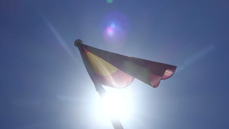 spanish flag flying on blue sky