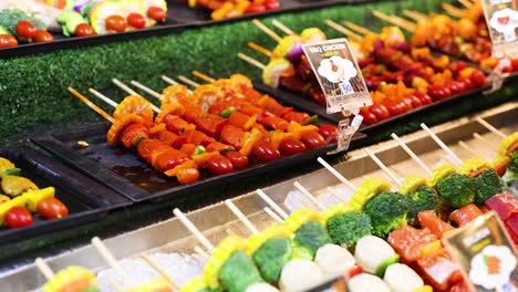 assorted grilled skewers at a food market