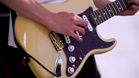 person playing electric guitar