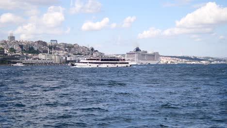 a cruise ship sailing past a city skyline in istanbul, turkey