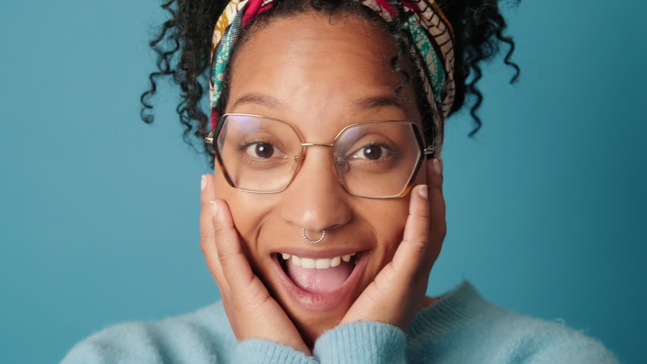 Portrait of a Young Woman Showing Surprise and Happiness