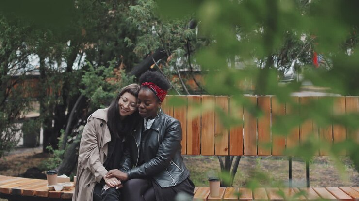 Happy Lesbian Couple Being Affectionate in Park