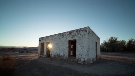 abandoned building in the desert at sunrise/sunset