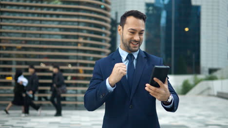 excited businessman wins investment trade, man trader in suit looking at phone screen outdoor office while bitcoin keeps bull run rising up