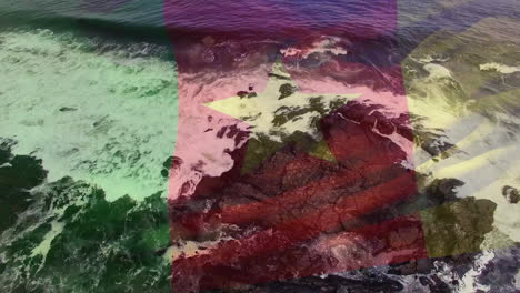 composición digital de la bandera de camerún ondeando contra la vista aérea de las olas del mar