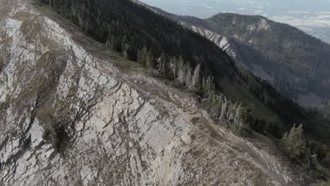 Man-hikes-a-ridge-line-in-the-mountains-of-Montana-alone