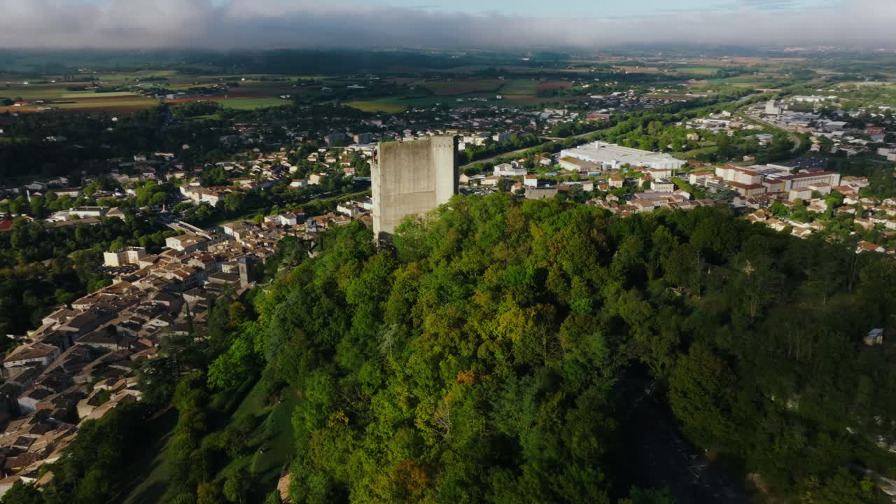 Aerial during sunshine day over the tower of Crest, a town in the Dr&ocirc;me, region of Auvergne-Rh&ocirc;ne-Alpes, France